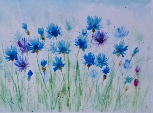 Card with watercolor design of blue and purple flowers on a wooden surface