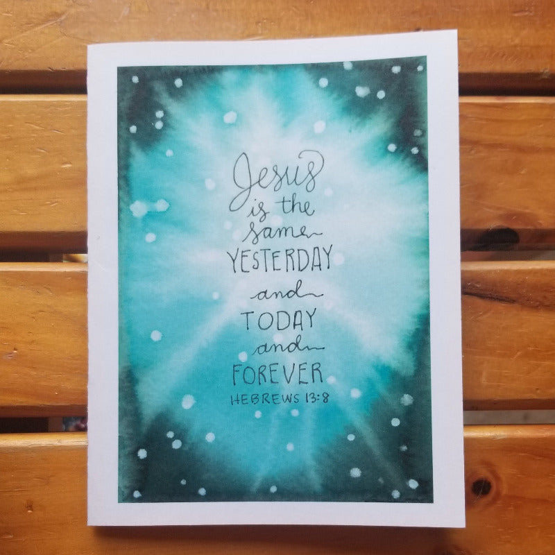 Card with inspirational quote on a wooden surface