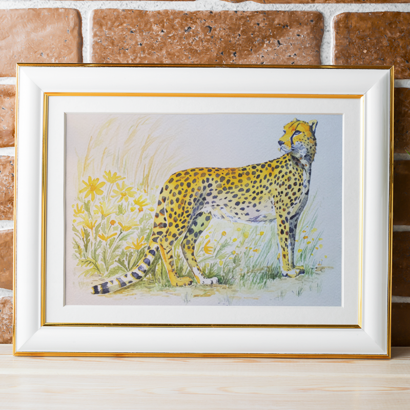 Cheetah with yellow flowers in the background