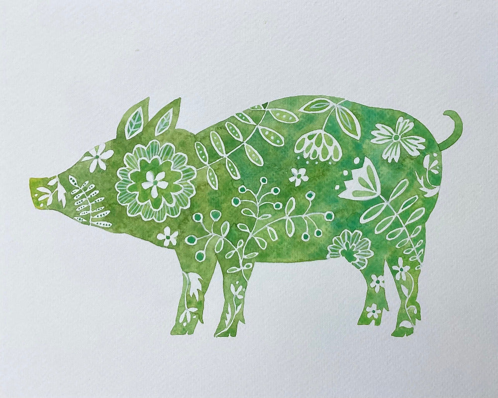 Green silhouette of a pig with floral patterns on a white background