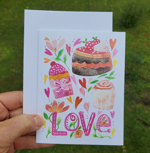Cheerful baked goods with the word Love card
